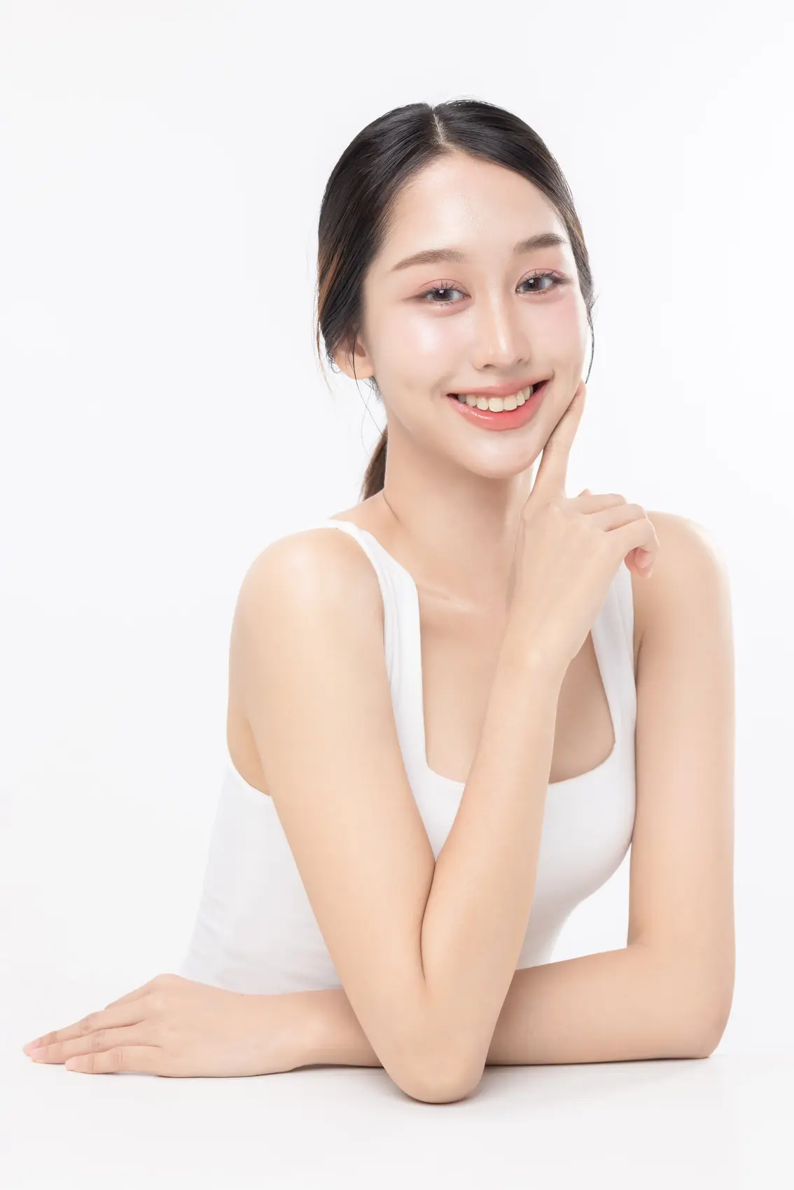 Portrait of a young Asian woman with glowing skin